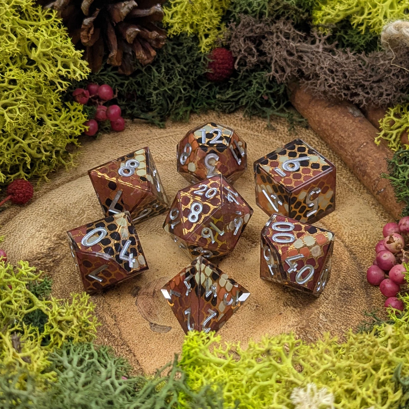 Set of dice with intricate designs on a natural background